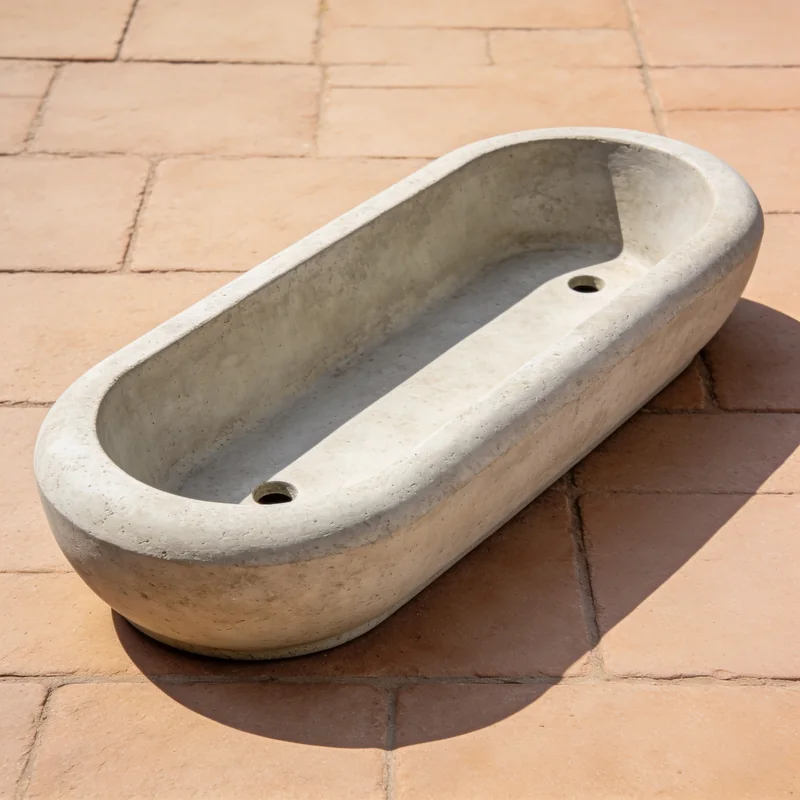 Low oval fiberstone planter showing its empty planting cavity